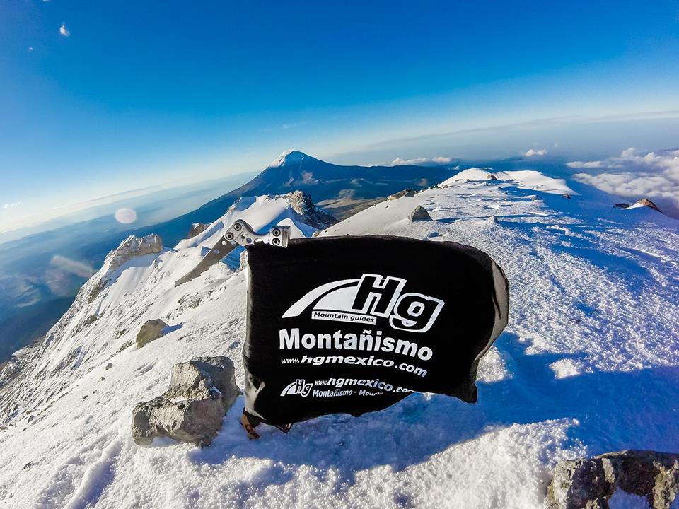 Climbing at the Iztaccihuatl mountain, flag in the summit
